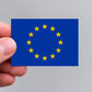 A hand holding a European Union flag sticker by Gobrecht & Ulrich