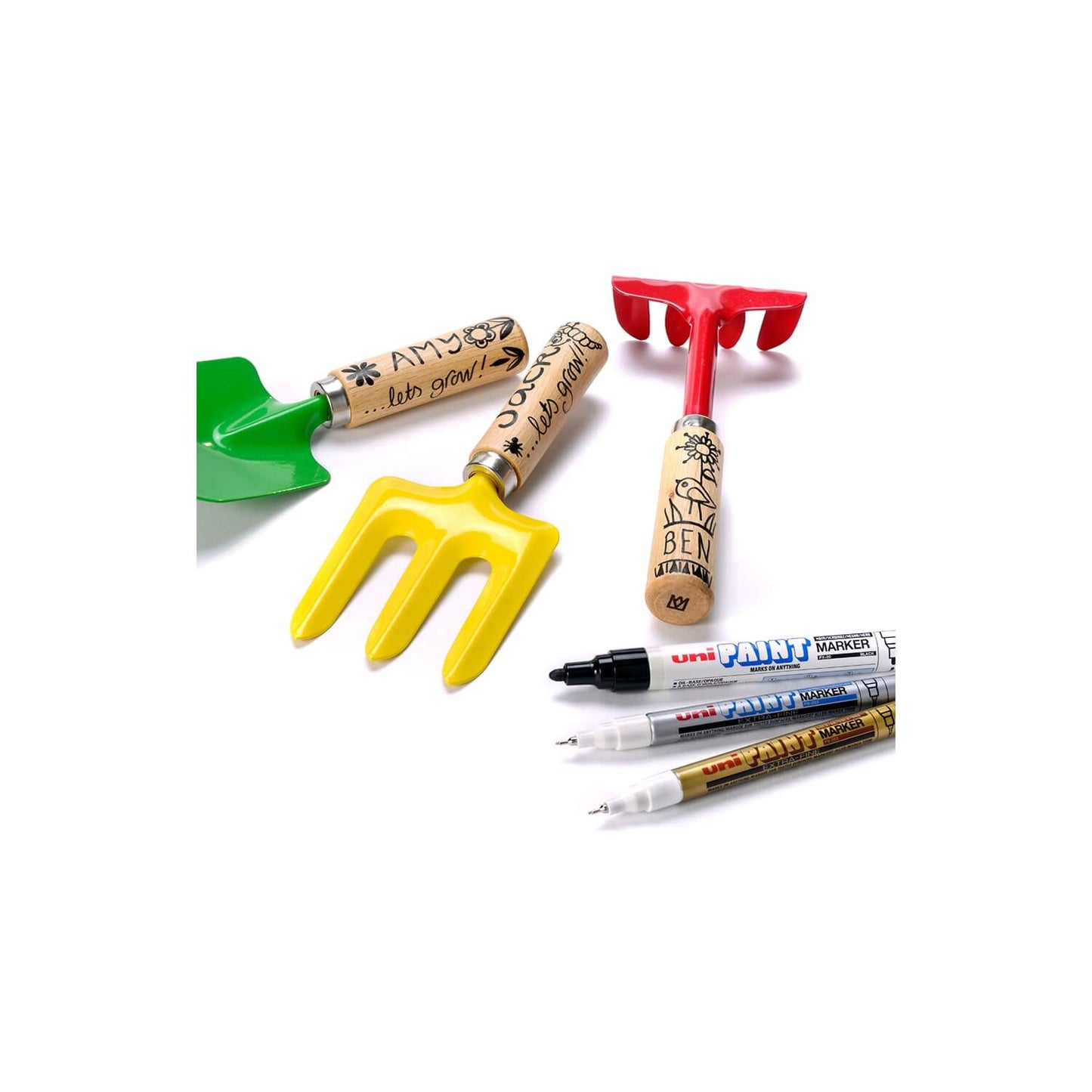 Set of gardening tools and markers on a white background