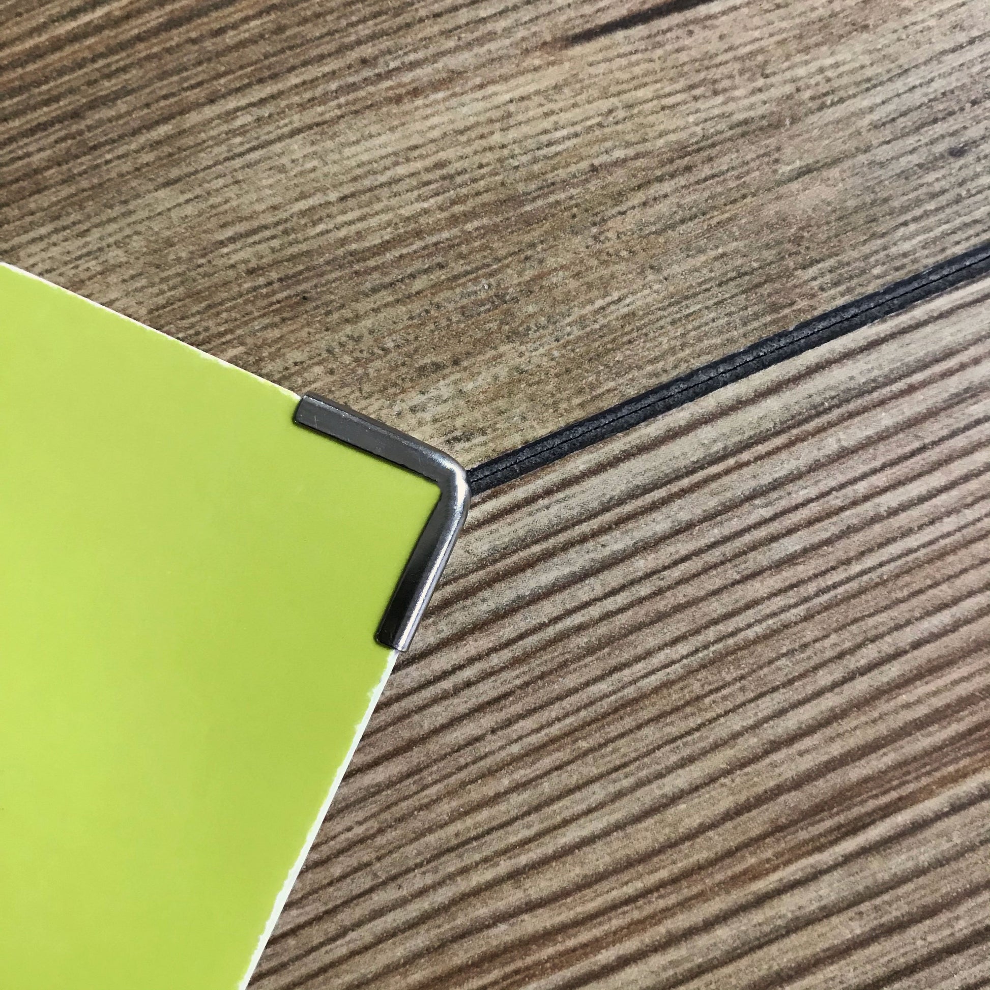 Silver Softcover Book Corners 15 x 15 x 2mm used on a folder