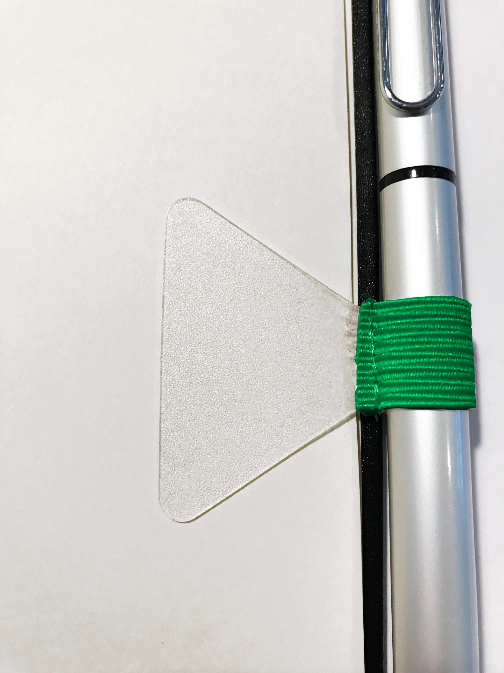 Gobrecht & Ulrich Green Self-adhesive Pen Loop on notebook