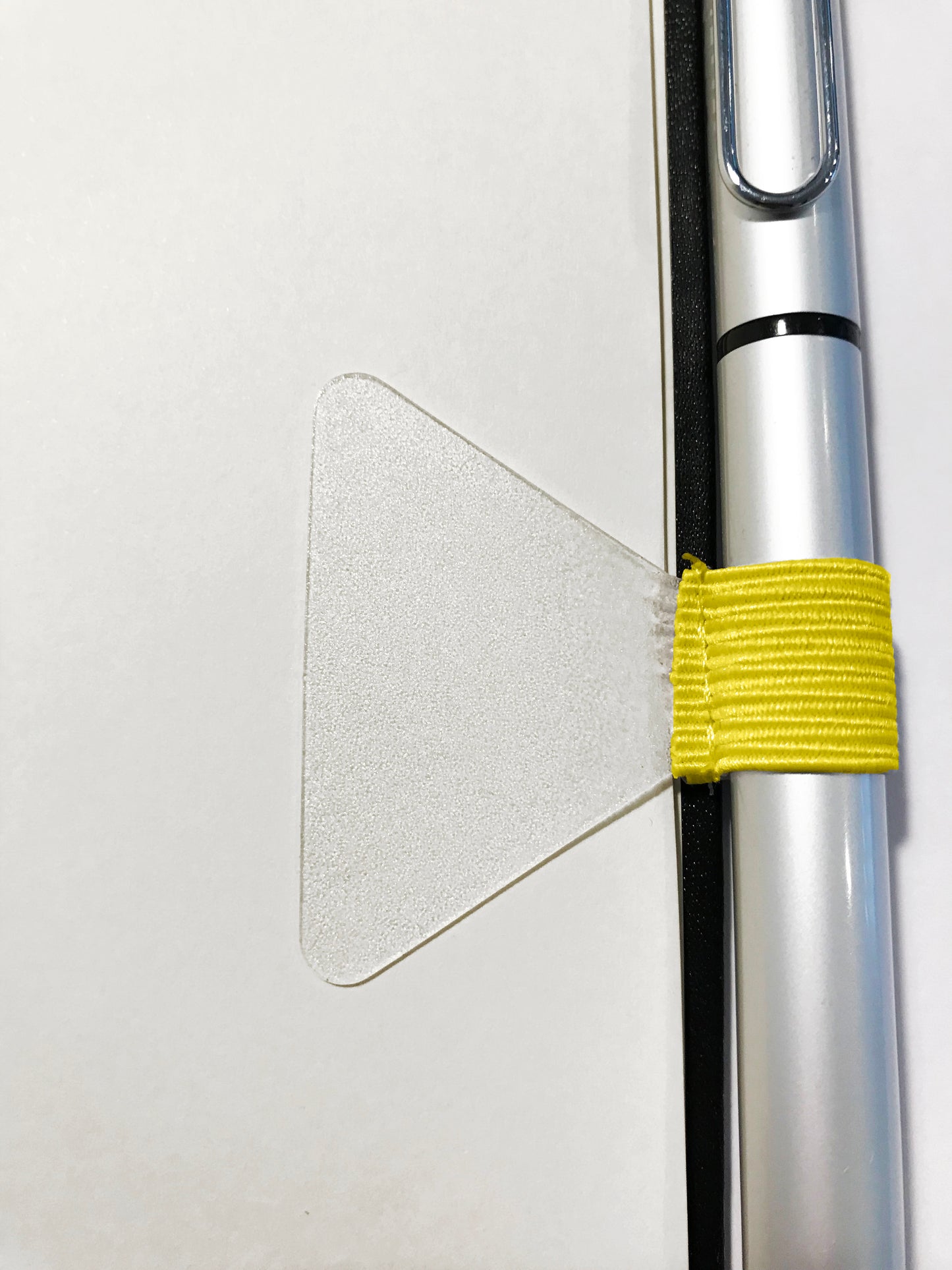Gobrecht & Ulrich Yellow Self-adhesive Pen Loop in use - attached to notebook
