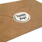 Thank you sticker on back of paper envelope