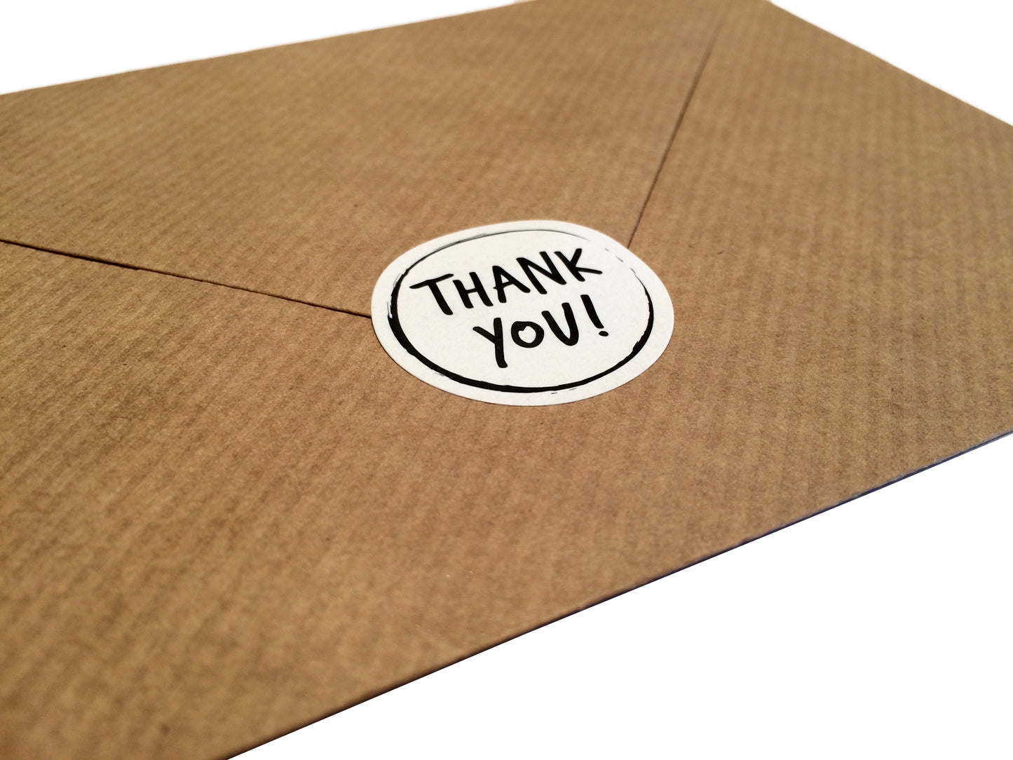 Thank you sticker on back of paper envelope